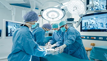 Surgeons work together in an operating room